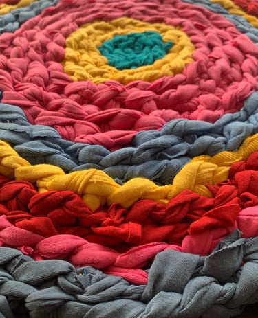 handmade multi-coloured crochet rug