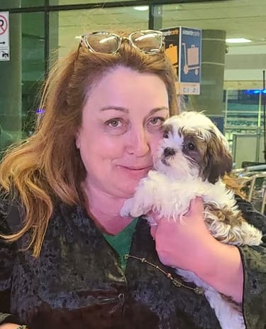 Female Mal-Shi Puppy with woman in black shirt