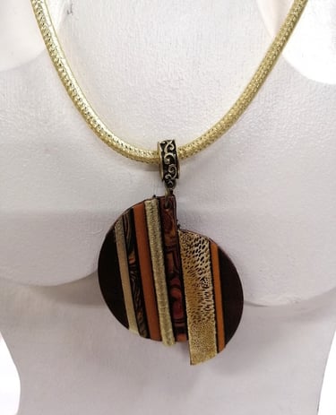 a necklace with a striped necklace on a mannequin