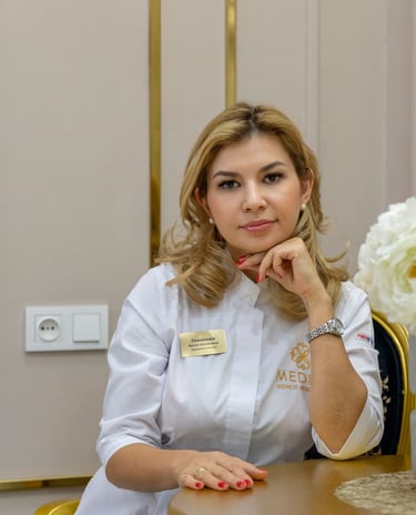 a woman in a white shirt and a vase with flowers