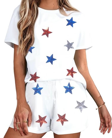 Women wearing white two-piece lounge set with red, blue, and silver sequin stars.