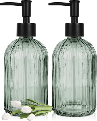 a pair of soap dispensers with tulips and tulips