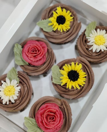 Cupcakes with roses, daisies, and sunflowers