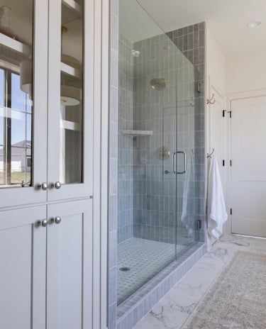 Blue tiled frameless shower enclosure, premium shower repair