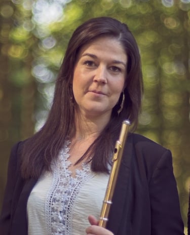 a woman in a black jacket and a woman in a white top