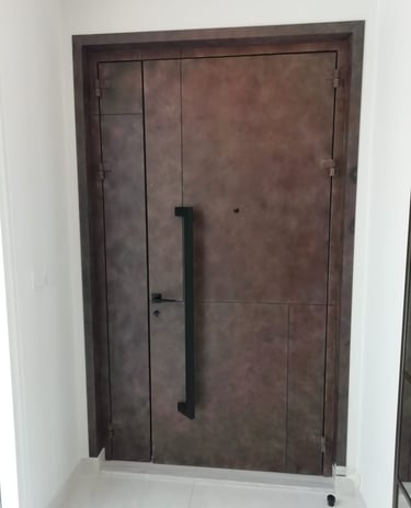 Bespoke wood-effect metal security door for luxury residential villa in Dubai.