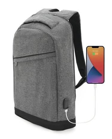 Grey water-resistant laptop backpack with integrated USB charging port connected to a smartphone.