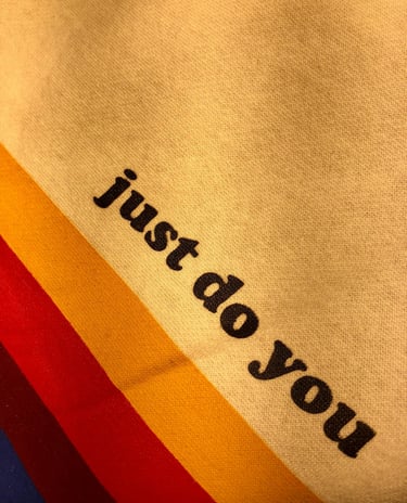 a colorfully coloured sweatshirt with the words just do you
