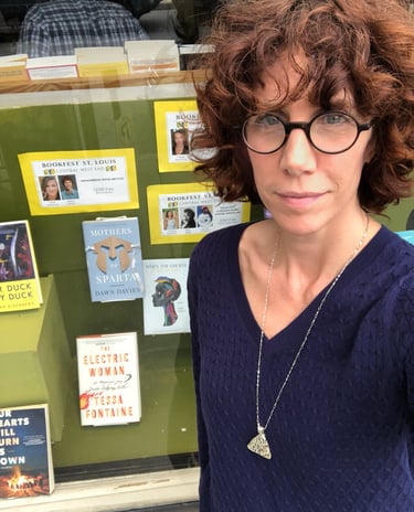Author Dawn Davies selfie in front of a bookstore window