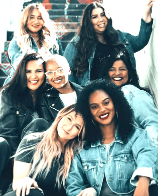 a group of women sitting on a couch