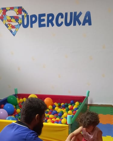 a man and a little boy playing with blocks and toys