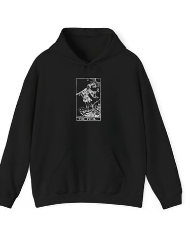 a black and white hoodie with the fool tarot on it