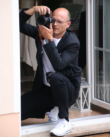 a man in a suit and tie is taking a picture of himself