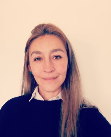 Professional psychologist smiling for a photo in formal wear