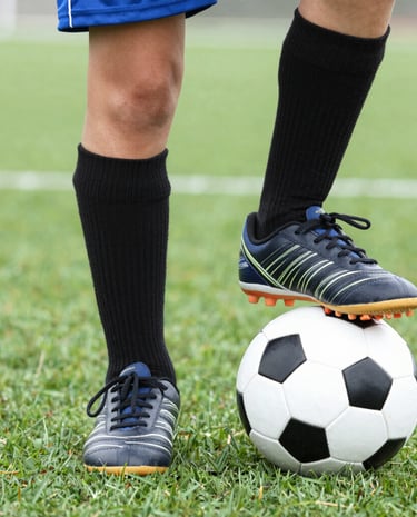 Group of kids celebrating a goal together, full of hope and excitement.