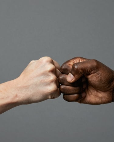 Close-up of hands shaking, symbolizing partnership and trust.
