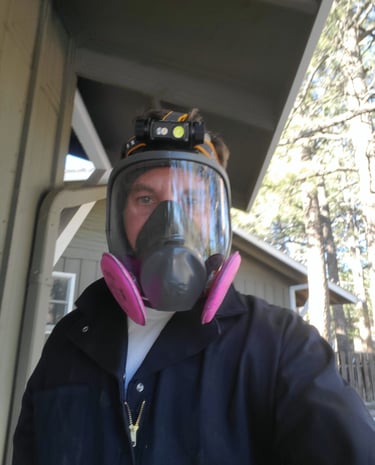 Inspector Felix in his PPE after inspecting a crawlspace at a home in Evergreen.