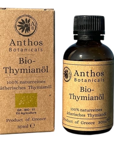 a bottle of thym oil with a box of thym