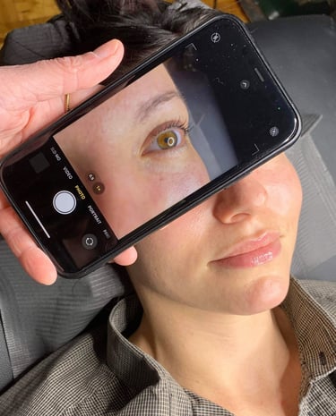 cellphone image of a woman's eye