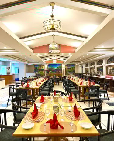 a restaurant with a long table and chairs