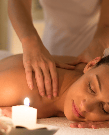 a woman getting a massage at a spa