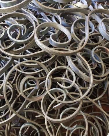 close-up of scrolls, showcasing before installation in pergula