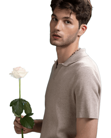 a sugar boy in a polo shirt holding a rose