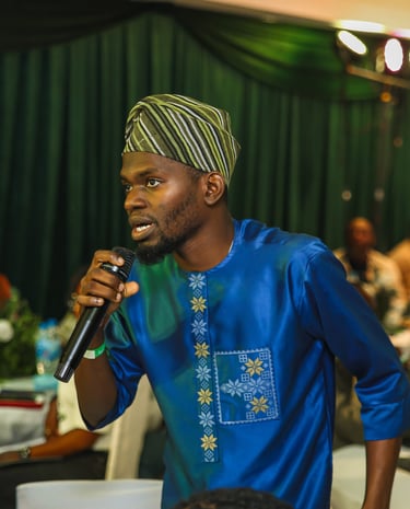 A participant asking a question to the panelists