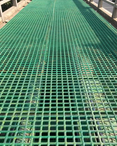 GFRP rebars integrated into a large-scale bridge construction site under bright daylight.