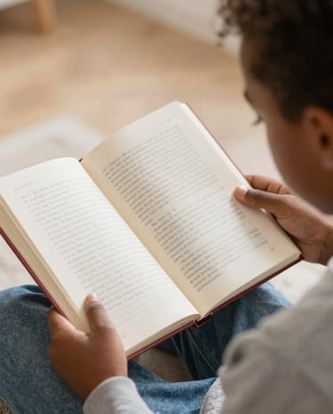 A smiling child playing with pastel-hued building blocks in a softly lit room.