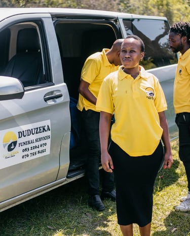 Duduzeka Funeral Services staff in yellow uniforms by their professional transport van.