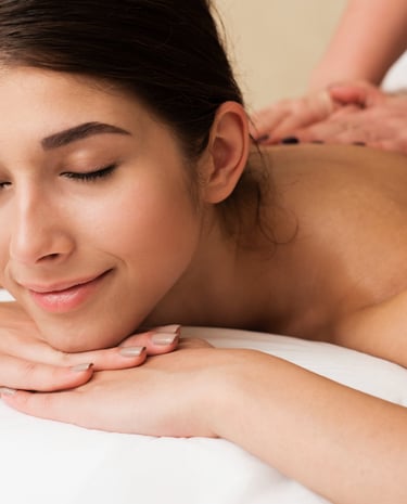 a woman getting a massage at a spa