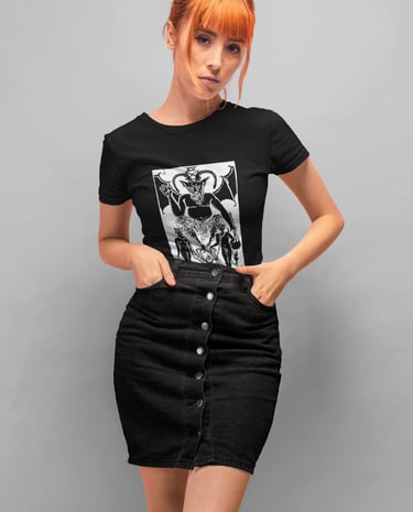 a woman in a black top with a black and white photo of the devil tarot