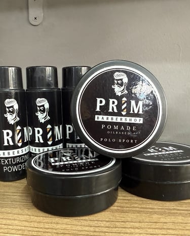 a man in a barbershop getting his hair cut