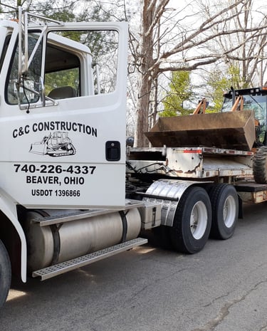 hauling backhoe to a job