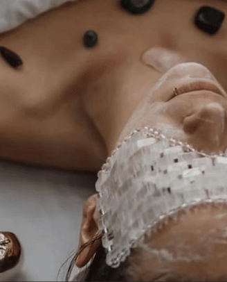 a woman getting a Ayurvedic therapeutic massages at a spa