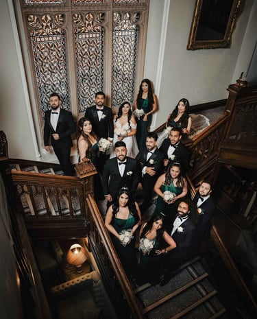 Wedding party on grand staircase, shot by Fred Art Studio