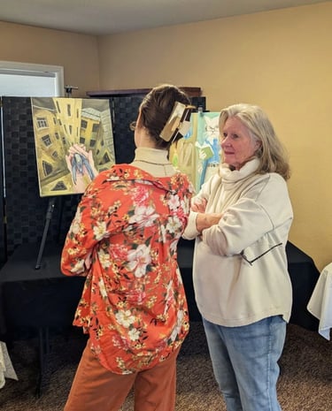 Takara Welter discussing an original Takara Welter painting at an Art Showing