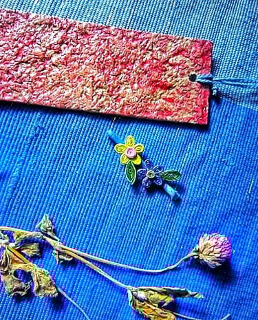 purple and yellow lower hair clips with recycle paper red texture bookmark also black dry flower pendant 