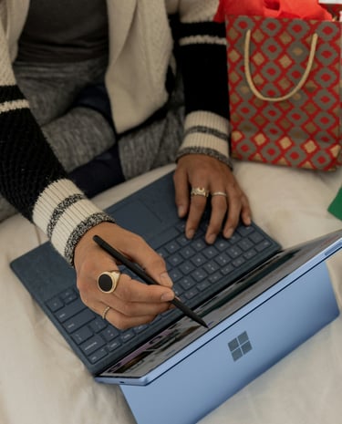 Consumer advice and product reviews researched on a laptop at home during holiday shopping, with gif