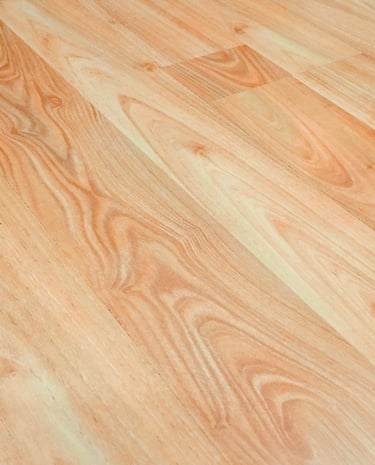 Light brown oak laminate flooring with realistic wood grain texture for home interior design.