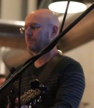 William Finn from Finn's Echo performing in front of live audience