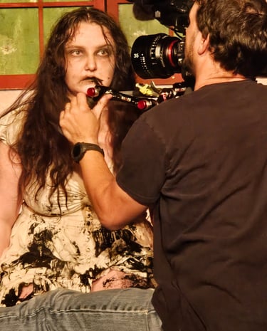 Delaney Harrington sits for a closeup. BTS 2024 Proscenium Crossed