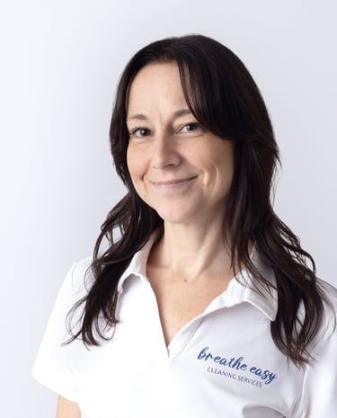 a cleaning professional smiling