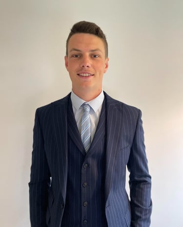 Daniel Stansbie in a blue pinstripe suit