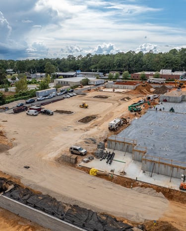 a large building with a lot of construction equipment