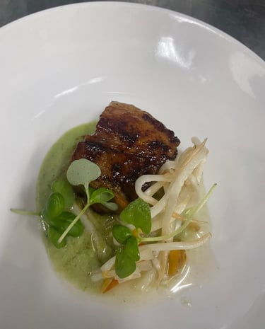 Pork belly with green curry puree and pickled carrots and bean sprouts