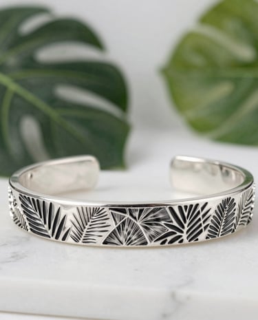 Elegant display of silver rings and necklaces on a sleek black and white background.