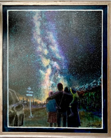 Family of four admiring Milky Way in the mountains