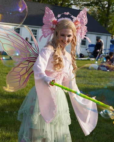 Bubble fairy smiling making bubbles